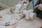 restorer fixes piece of white marble statue