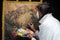 Restorer working on oil painting canvas