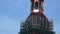 Restorers working on a 13th-century church tower restoration.