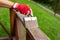 Restoring wood protective paint on outdoor patio railings