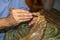 Restoring Wooden Sculpture: Close-up of Restorer working on Religious Works