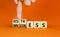 Restress for wellness symbol. Concept words Restress and Wellness on wooden cubes. Businessman hand. Beautiful orange table orange