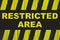 Restricted area warning sign with yellow and black stripes