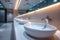 Restroom ambiance modern interior with row of white ceramic sinks