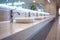 Restroom setting modern interior with a row of white ceramic sinks