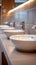 Restroom setting modern interior with a row of white ceramic sinks