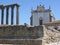 Rests of an old temple in front of a church to  Evora in Portugal.