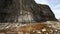 Rests of stone colmns near Pillars cape rock Kunashir, Kuril islands