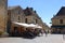 A restuarant called Pizzeria Raffaello in the town square in the bastide town of Domme in the Dordogne