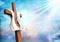 Resurrection. Christian cross with clouds sky background. Life after death