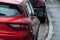 Retail of rain drops on red Renault Megane parked in the street