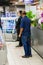 Retail shoppers practicing social distancing at Pick `n Pay grocery store during virus outbreak