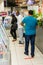 Retail shoppers practicing social distancing at Pick `n Pay grocery store during virus outbreak