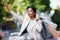 Retail, shopping and taxi with black woman showing hand sign for transport in an urban city. Female shopper looking