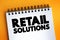 Retail Solutions text quote on notepad, concept background
