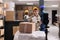 Retail storehouse worker recording smartphone video with goods unpacking