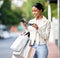 Retail woman, street and phone for credit card shopping online with easy ecommerce app ui. Girl consumer satisfied doing