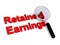 Retained earnings with magnifying glass on white