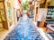 Rethymno, Crete, Greece - Tourist souvenir shops with handicrafts in a narrow street.
