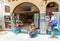 Rethymnon, Island Crete, Greece, - July 1, 2016: Family near the souvenir store `Book spot`. There are mother is taking photo wit