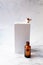 Retinol oil serum oil bottle on isolated marble background. Beauty care concept