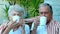 Retired couple enjoying coffee outside