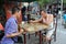 Retired elderly playing chinese chess as their past time along the walking street