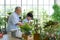 Retired grandfather spent the holidays with his grandson taking care of indoor garden