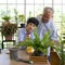 The retired grandfather spent the holidays with his grandson taking care of the indoor garden