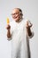 Retired Indian old man eating ice cream, standing icolated against white background