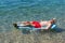 Retired man playing in sea water