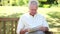 Retired man reading a newspaper