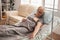 Retired old woman resting in bed in a nursing home