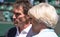 Retired player Pat Cash being interviewed by Sue Barker on centre court before the start of the men`s finals.