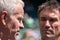 Retired players, Pat Cash and John McEnroe in conversation before the start of the men`s finals on centre court.