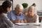 Retired spouses sign paper contract with help of professional agent