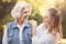 Retired woman enjoying summer with daughter in the park