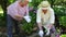 Retired woman giving flower to her husband