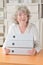 Retired woman holding files folders