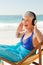 Retired woman listening to music