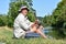 Retiree Male Fisherman Smiling With Fishing Rod Outdoors