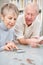 Retiree and pensioner couple doing accounting