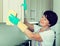 Retiree woman cleaning home