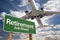 Retirement Green Road Sign and Airplane Above