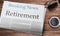 Retirement headlined newspaper on the table, News Paper\\\'s Name is Braking News