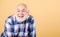 Retirement leisure. Man senior cheerful emotional smiling grandpa in checkered shirt. Senior people entertainment