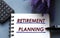 RETIREMENT PLANNING - words are written on a notepad with a marker, calculator and lavender sprigs