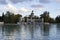 Retiro pond with the boats and ducks that are in the water with a slightly cloudy afternoon in the Retiro Park, in Madrid