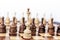 Reto black and white wooden chess pieces, queen in the foreground, leadership background