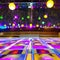 A retro, 1970s-style disco dance floor with mirrored balls and colorful lights4, Generative AI